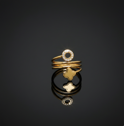 Gold Toned Spiral Ring with Clover and Logo Charms  Stainless Steel