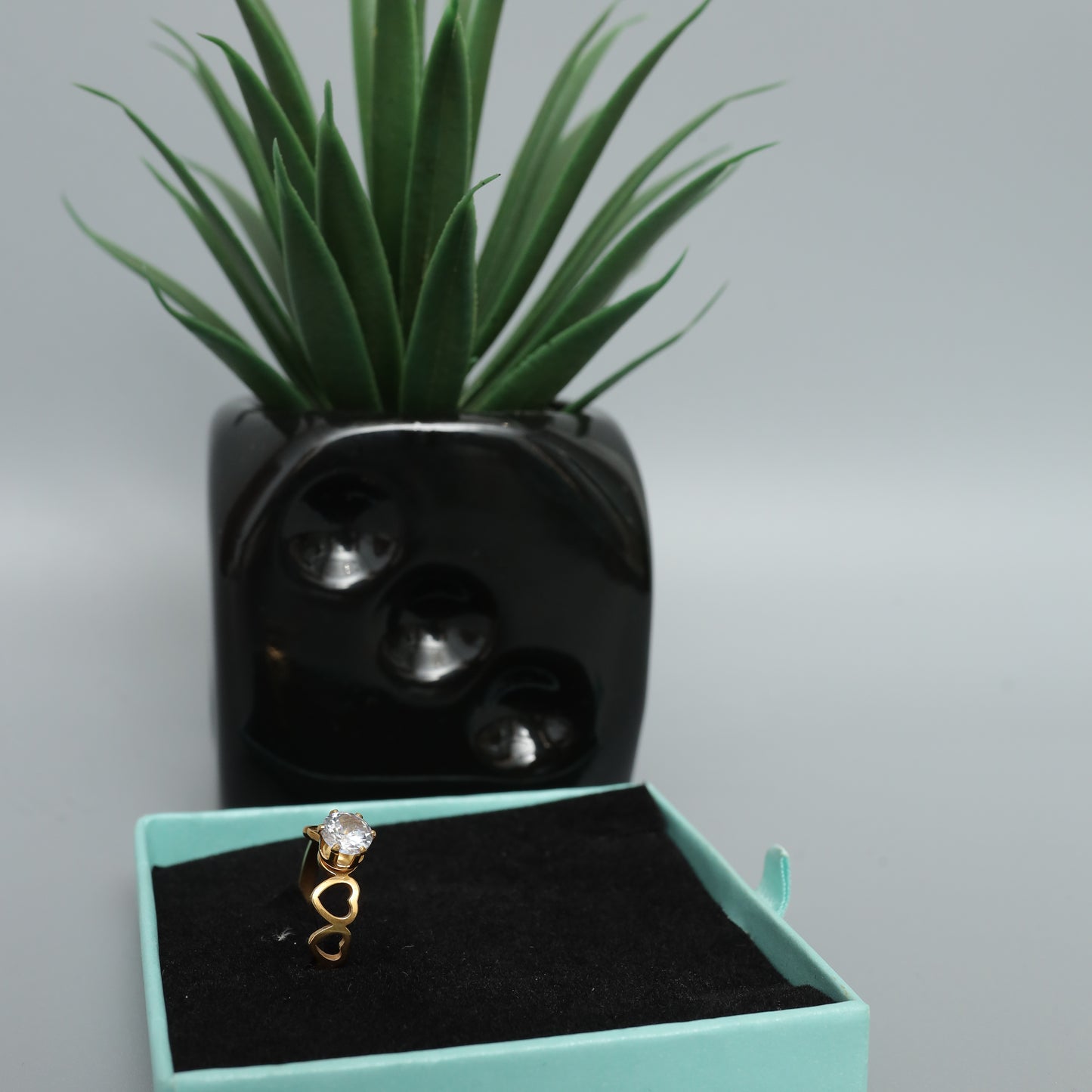 Gold Toned Solitaire Ring with Heart Detail Band  Stainless Steel