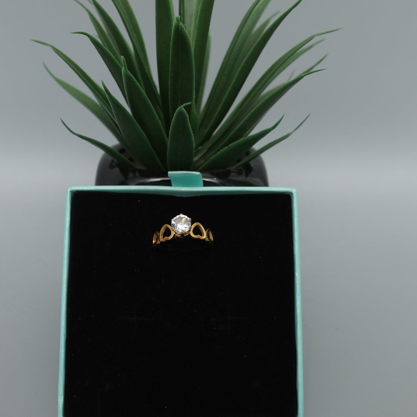 Gold Toned Solitaire Ring with Heart Detail Band  Stainless Steel