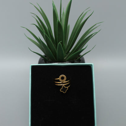 Gold Toned Spiral Ring with Clover and Logo Charms  Stainless Steel