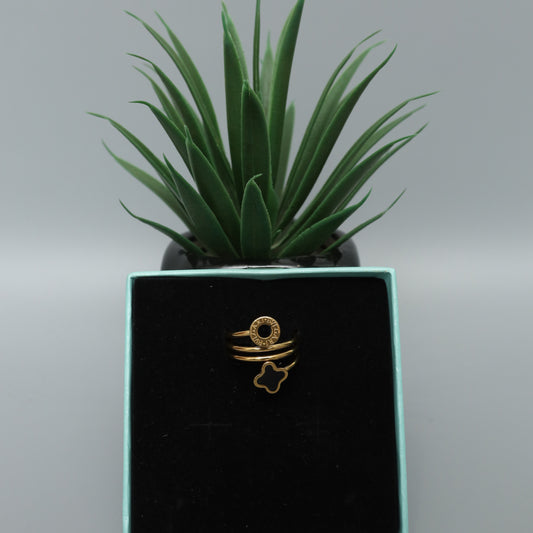 Gold Toned Spiral Ring with Clover and Logo Charms  Stainless Steel