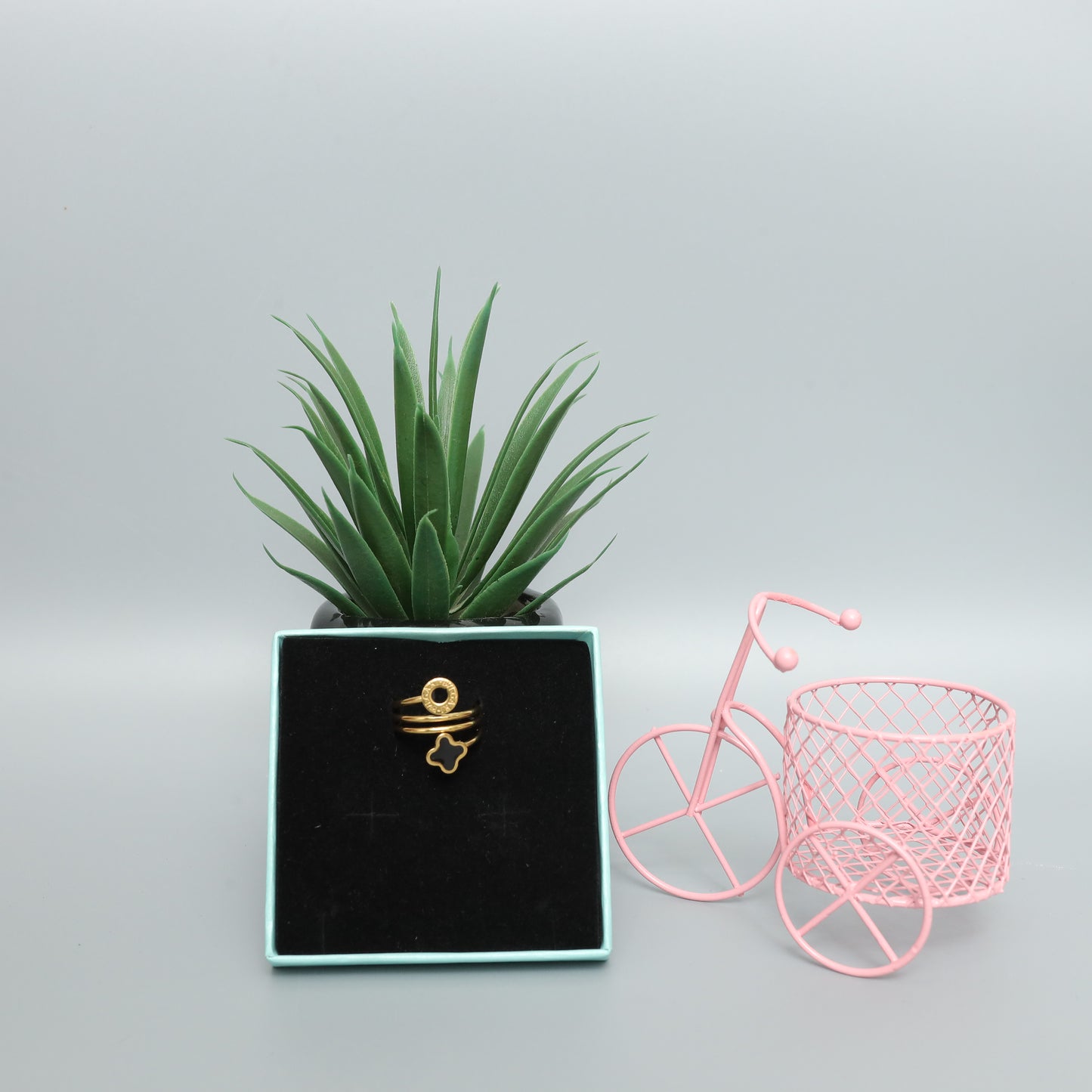 Gold Toned Spiral Ring with Clover and Logo Charms  Stainless Steel